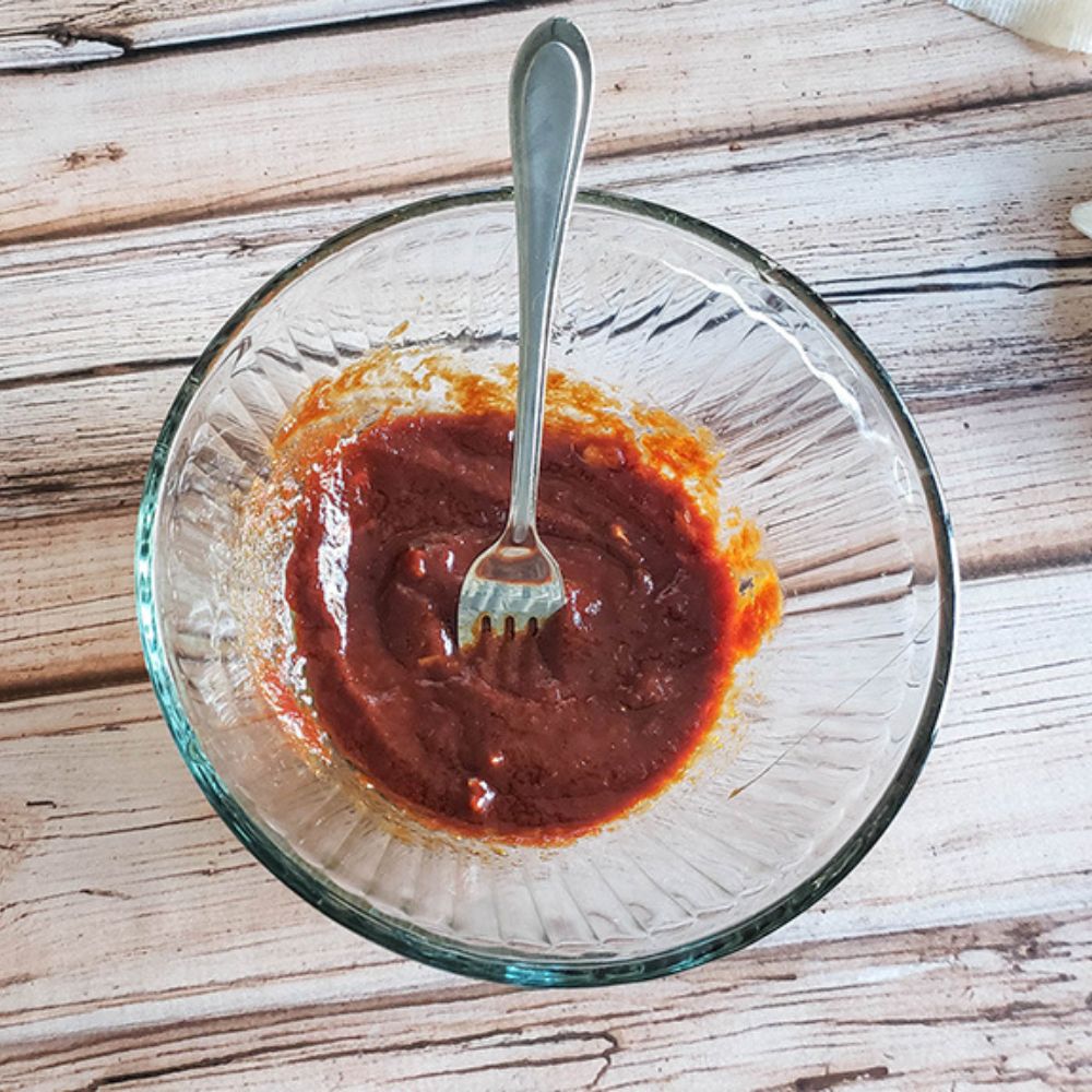 mixed homemade bbq sauce in a glass bowl