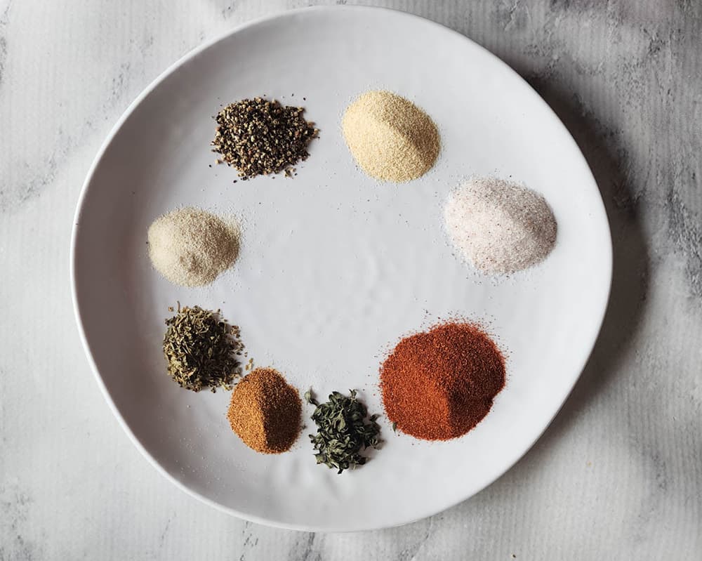 a picture of measured spices for cajun blend