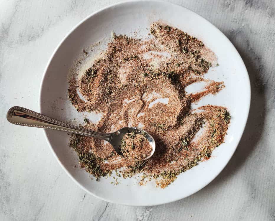 cajun spice blend mixed on plate with a spoon