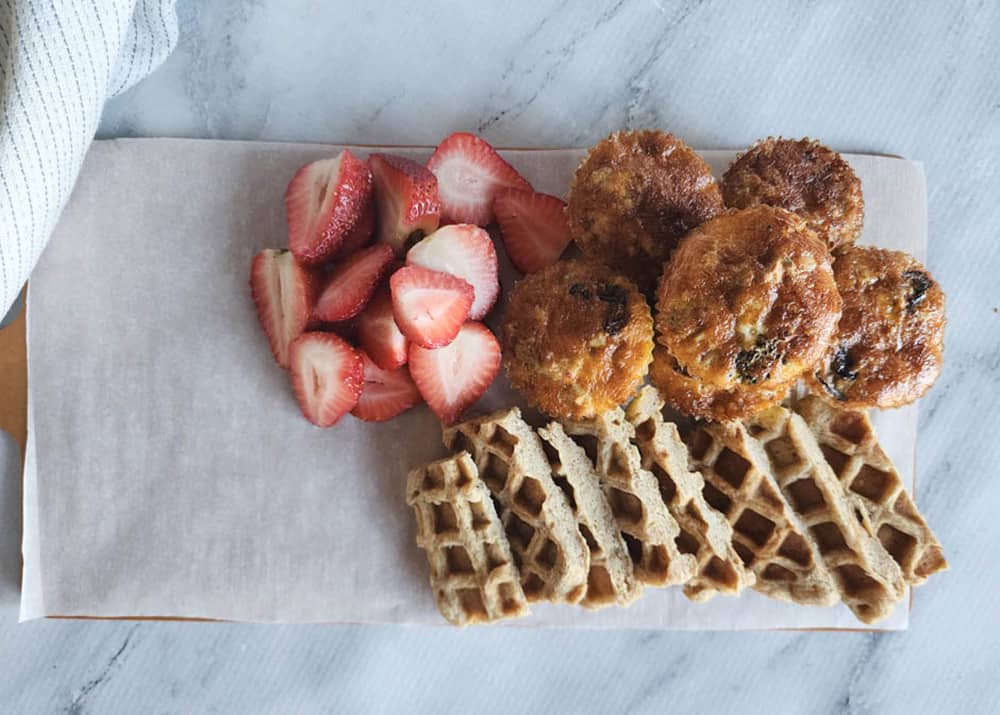 brunch charcuterie board process 2 add board half filled with waffles, strawberries and egg bites