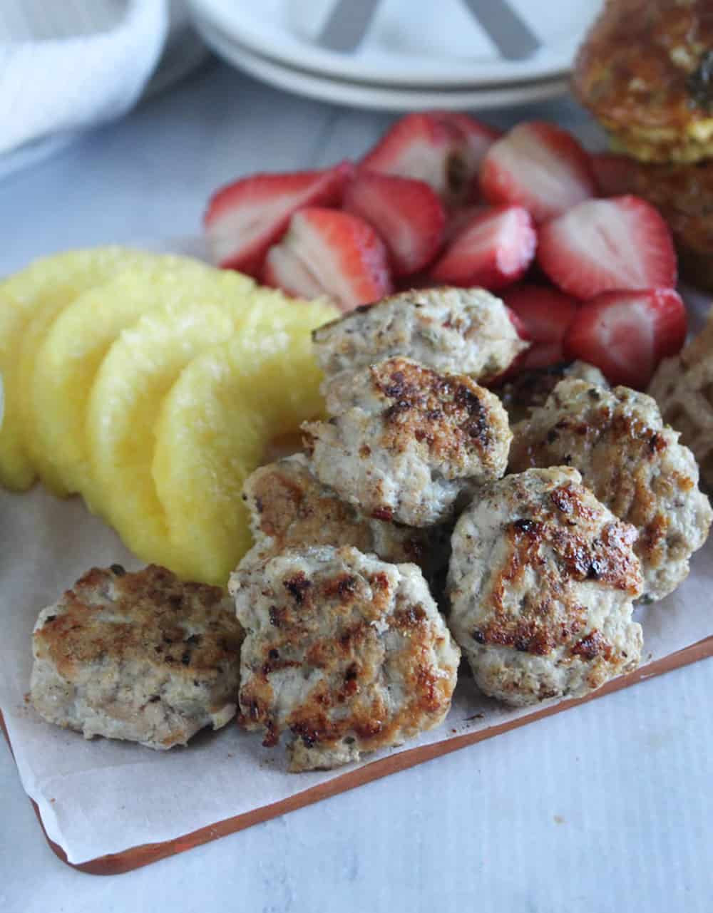 Brunch charcuterie board with sausage and fruit