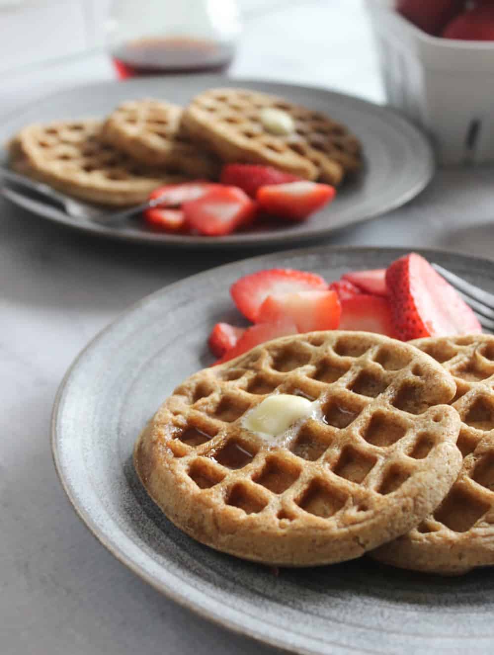 a clos up of waffles on a plate