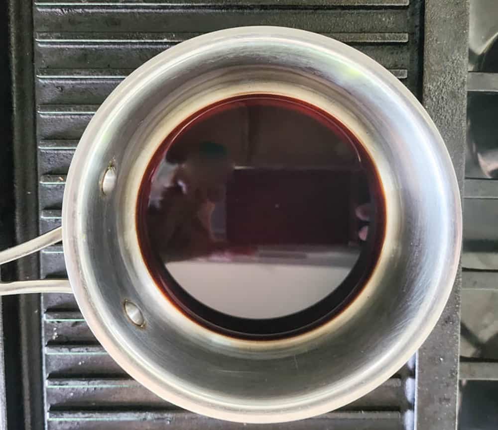 a picture of balsamic vinegar in a saucepan to make the glaze