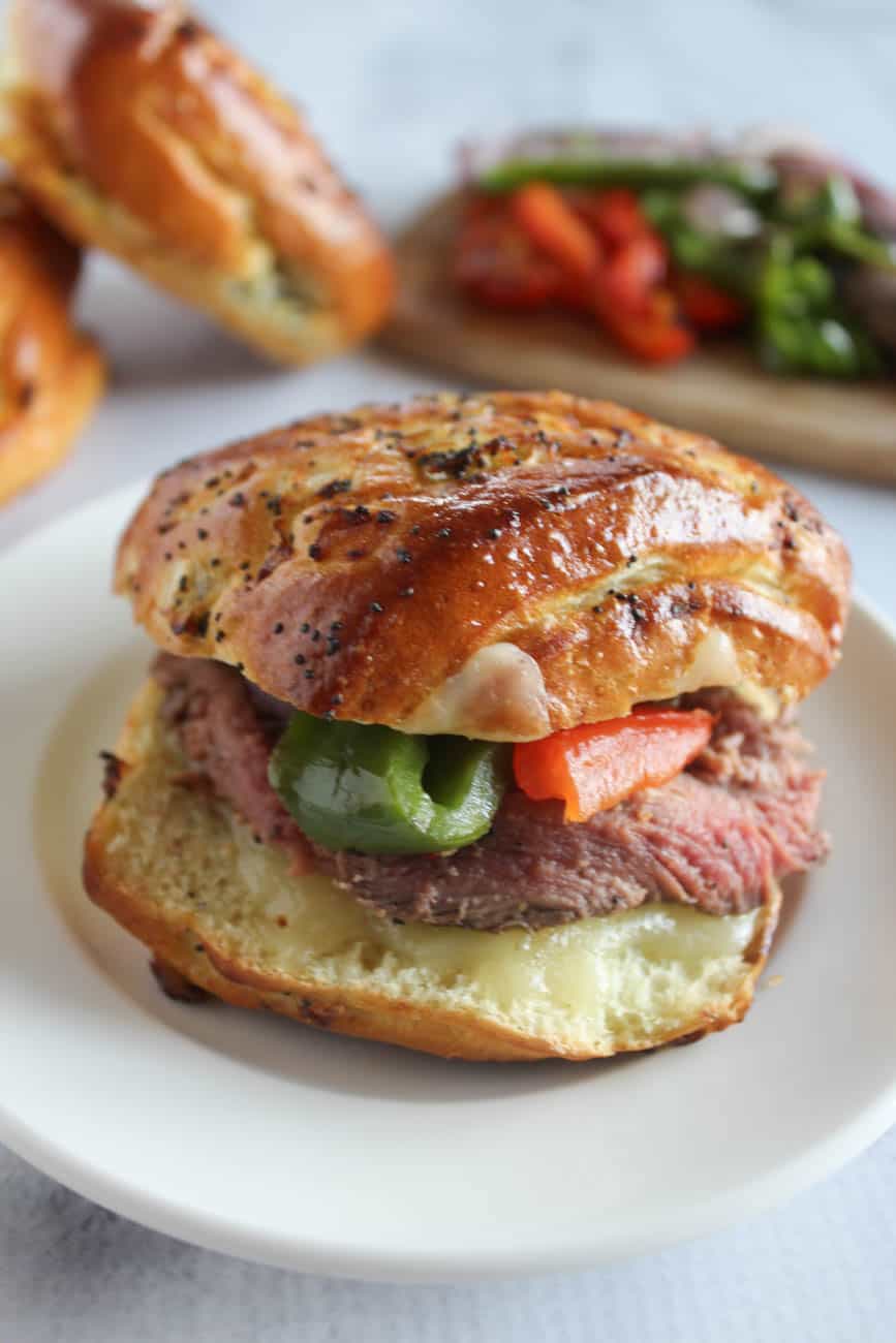 a picture of finished filet mignon sandwich on a white plate