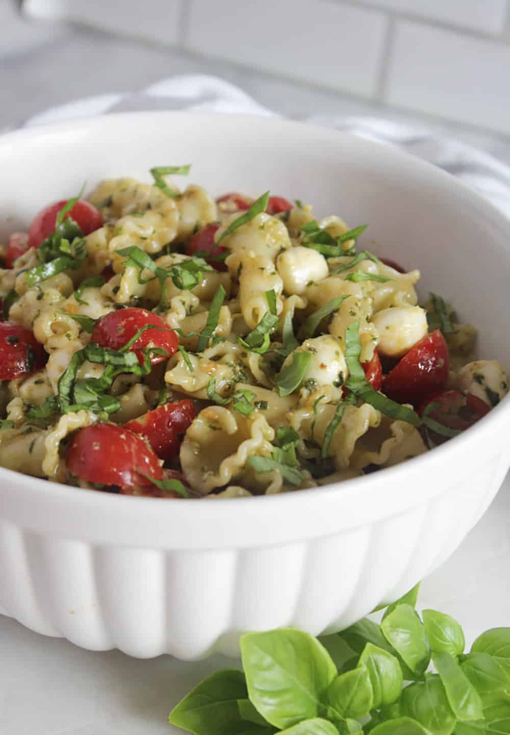 a picture of pasta salad in a white bowl