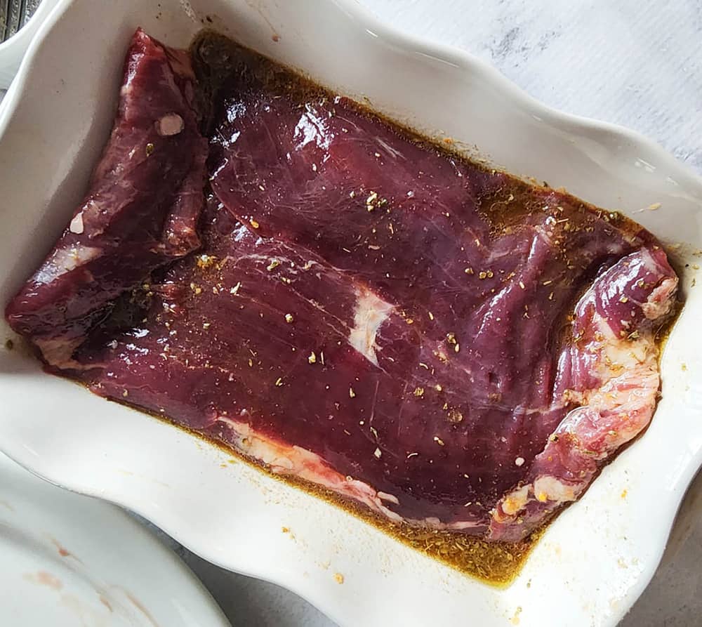 a picture of flank steak marinating
