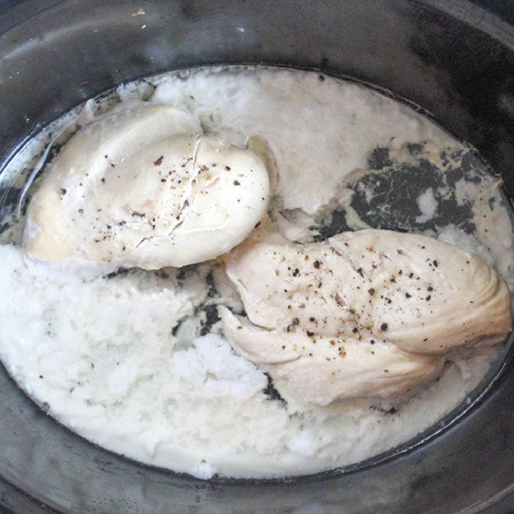 process step 2 cooked chicken in a slow cooker