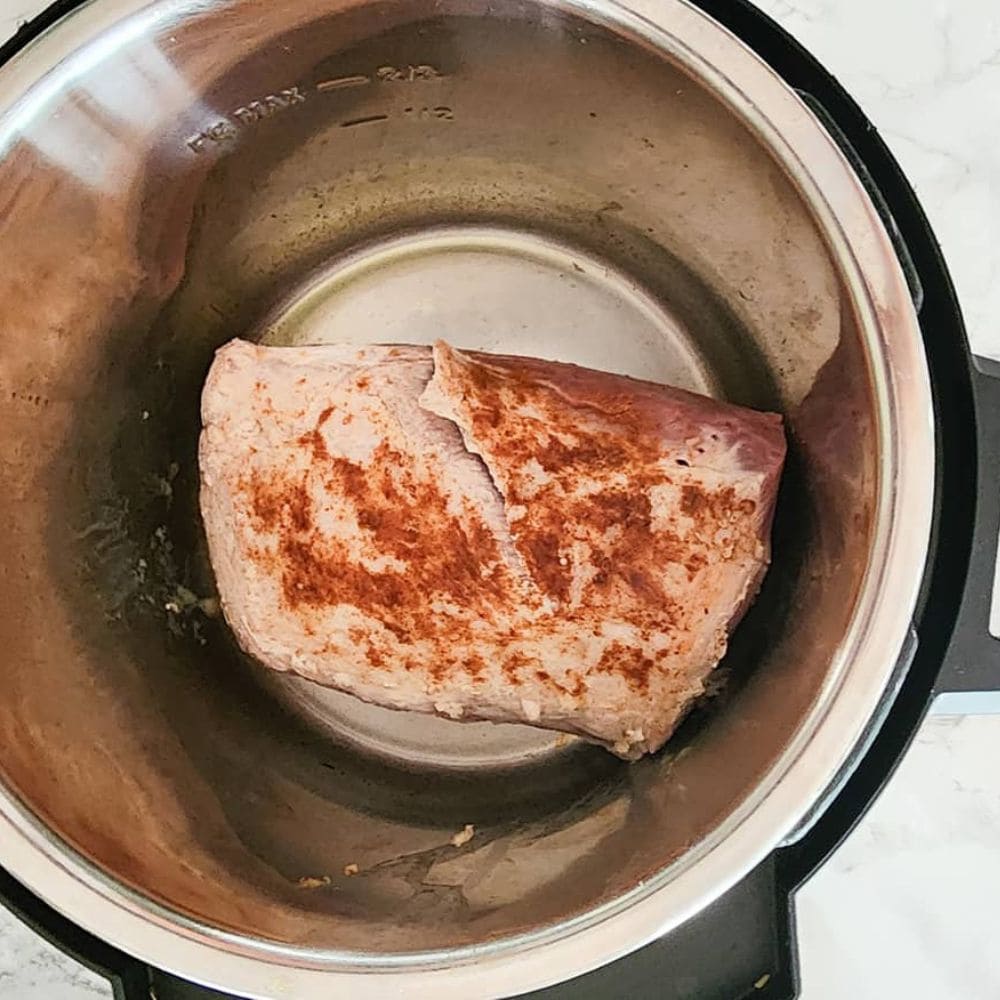 Process step 1 seasoned pork tenderloin in an instant pot searing