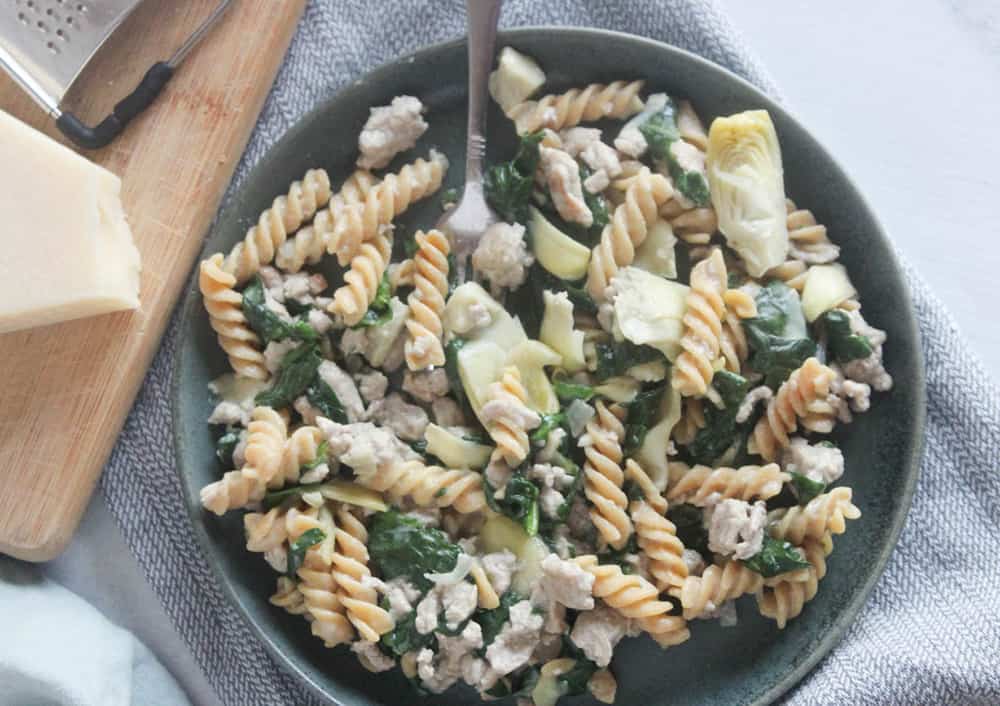 an overhead view of turkey spinach pasta on a plate