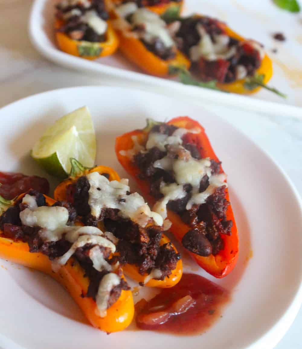 three pepper nachos on a plate with salsa