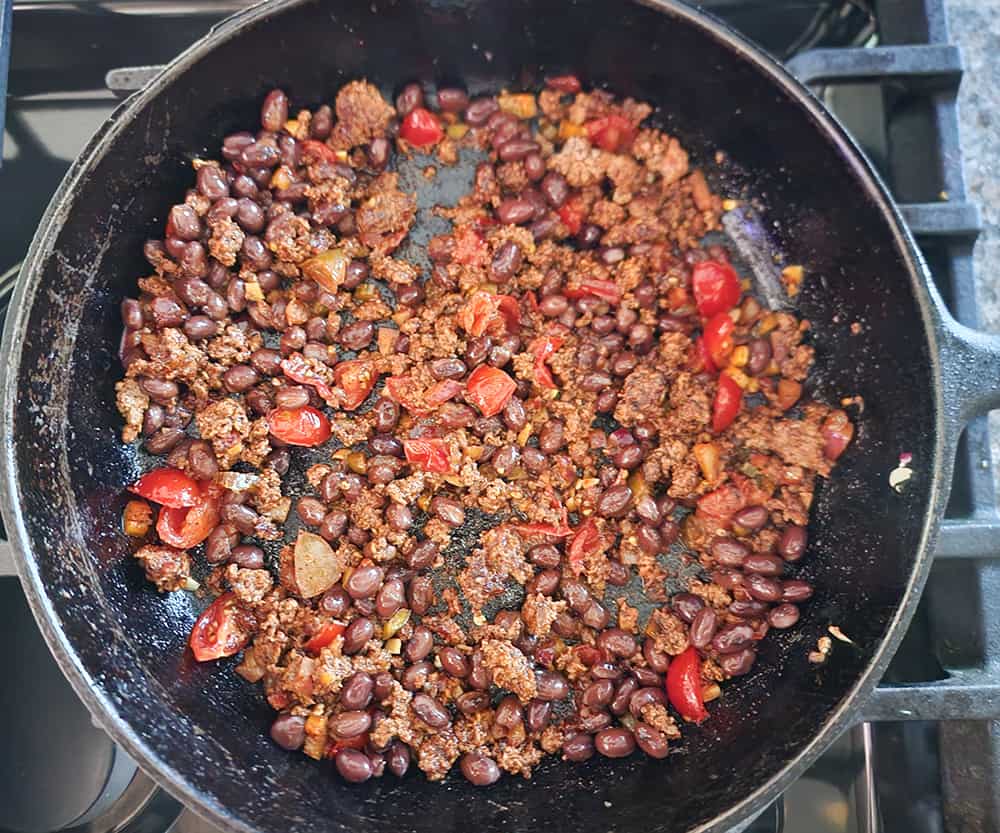 a picture of the meat and bean filling for pepper nachos