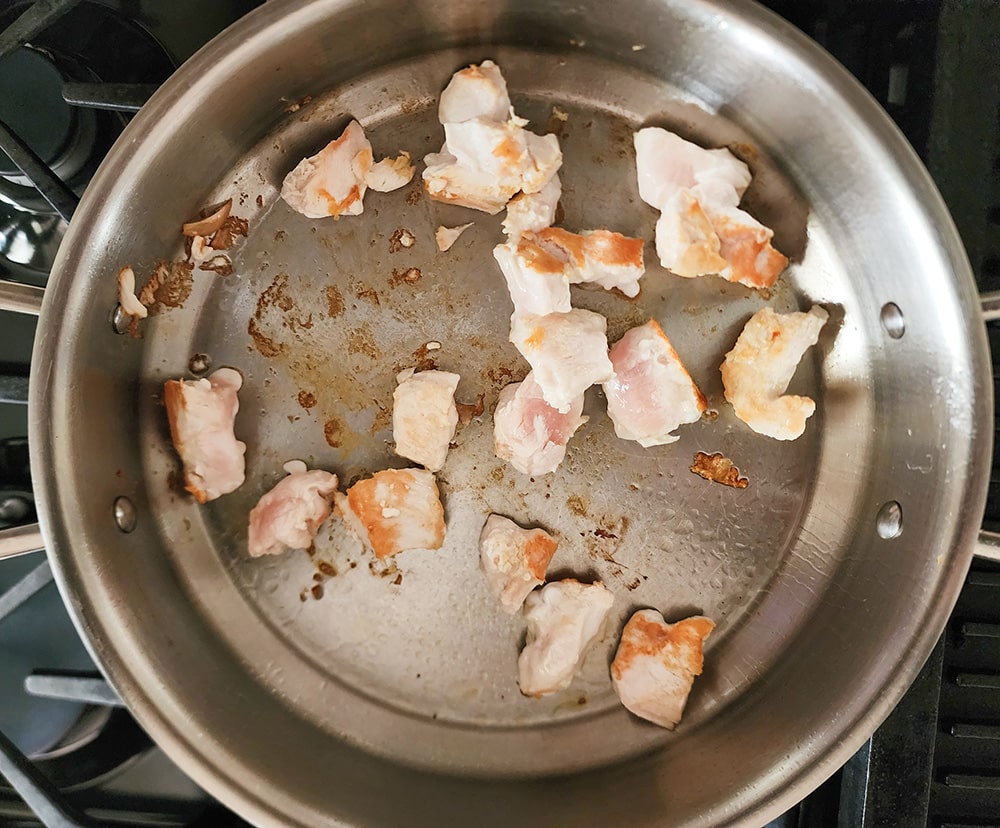 process step 1: chicken cooking in a large skillet
