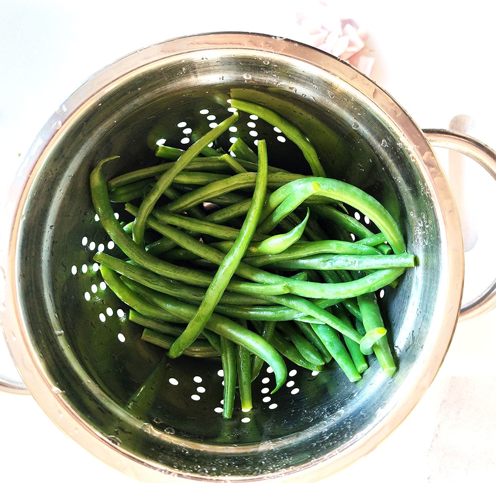 Step 2 green beans in colander after blanching and rinsing in cold water