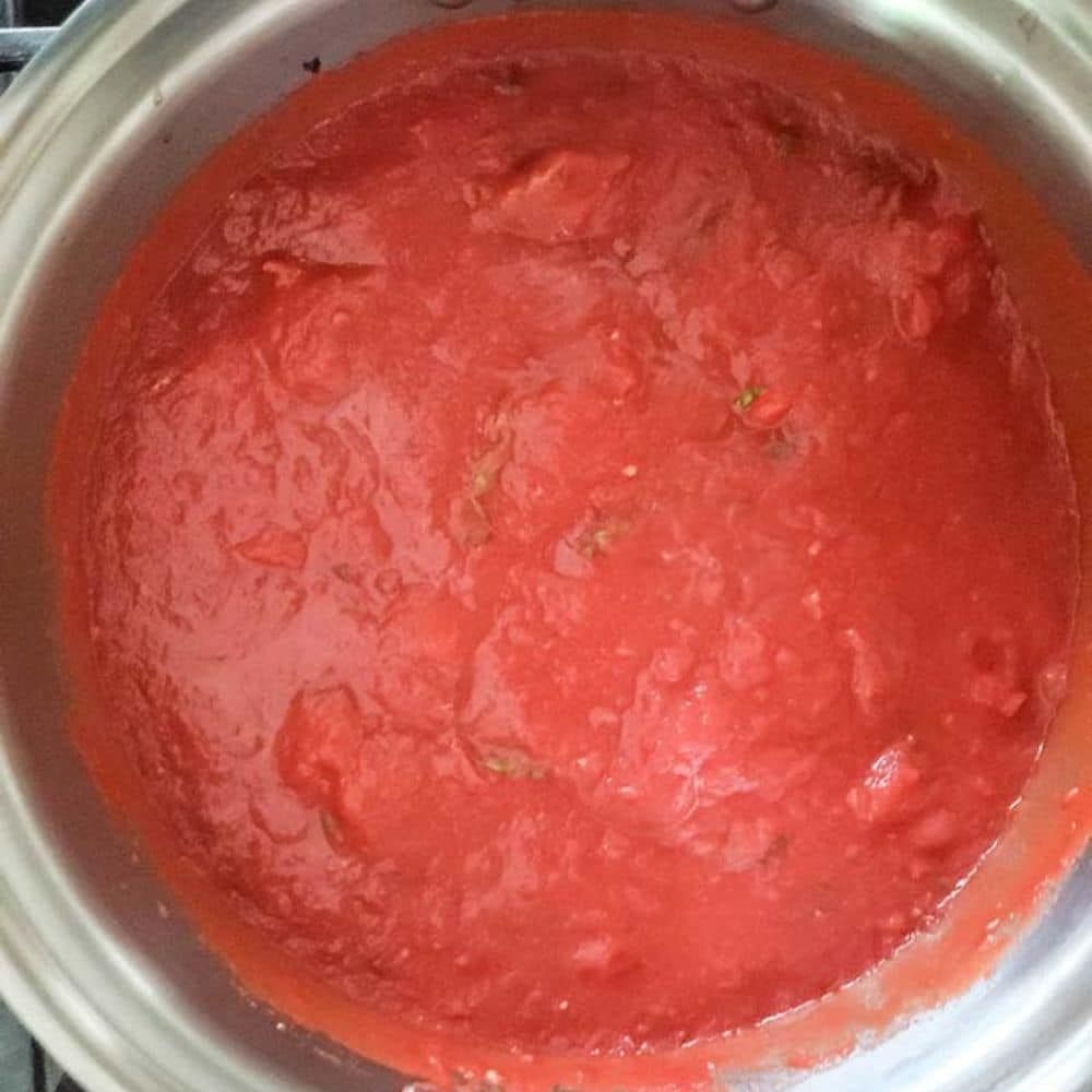 tomato sauce cooking in a pan