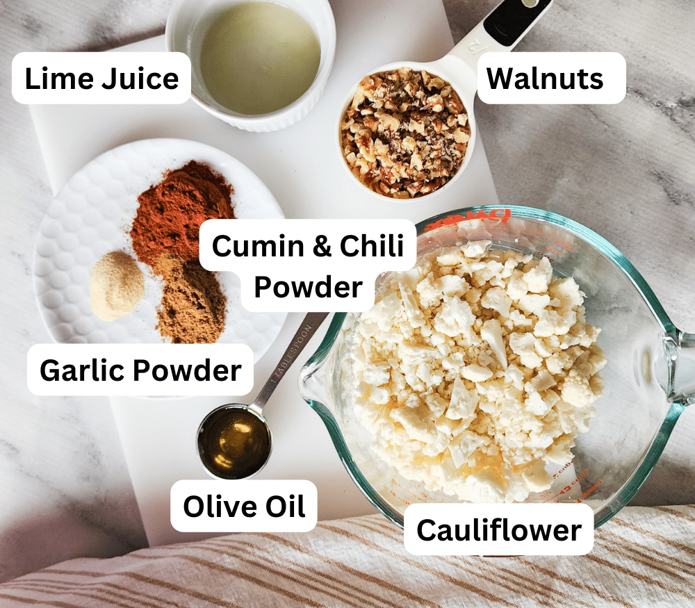 a picture of the ingredients needed to make cauliflower walnut taco meat: lime juice, walnuts, cauliflower, olive oil, Mexican spices