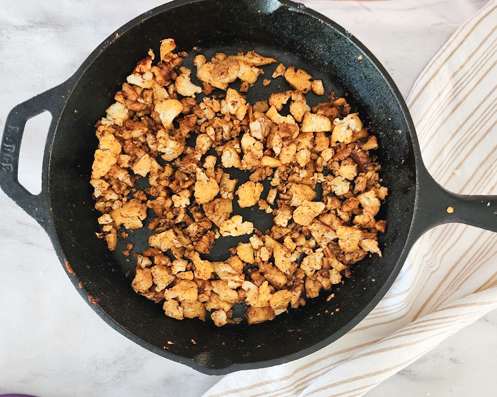 a picture of the taco meat prepared in a cast iron skillet