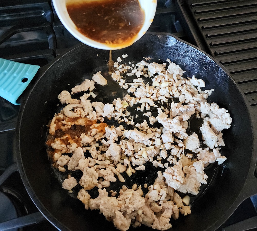 Process step 4 for turnip carrot mash, the turnips and carrots are mashed in a bowl
