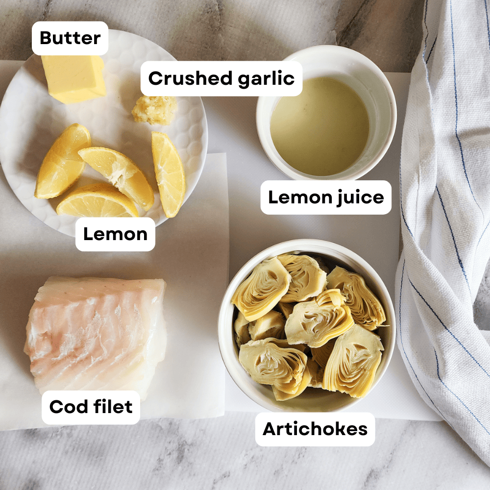 ingredients for garlic butter codifsh: artichokes, cod filet, lemon, butter, garlicc and lemon juice