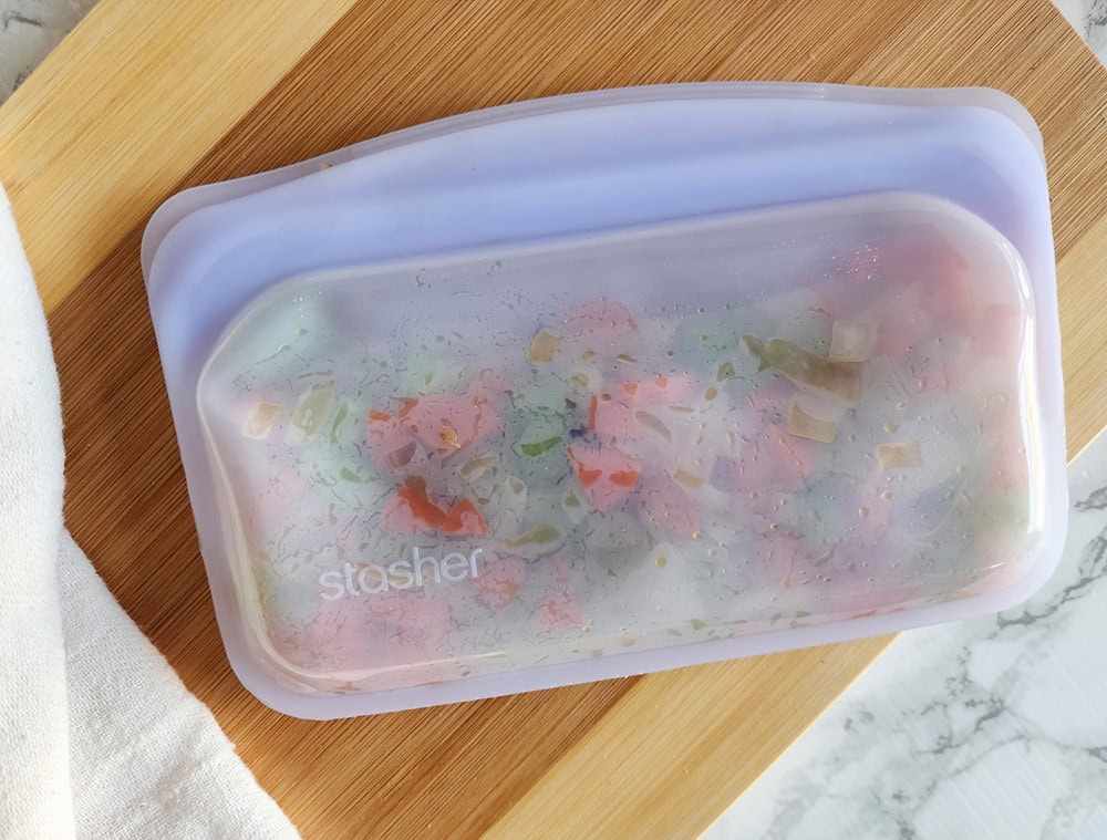 a picture of mirepoix in a stasher bag ready for the freezer
