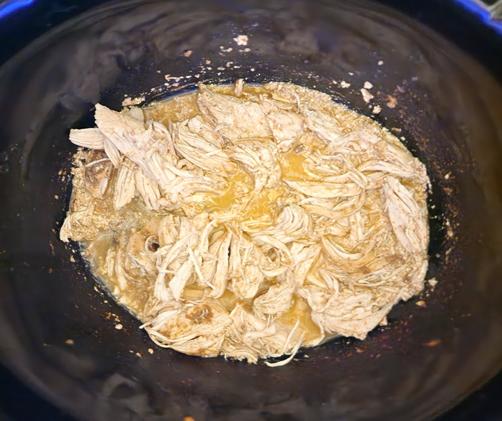 Step 4: shredded chicken in a slow cooker ready to serve.