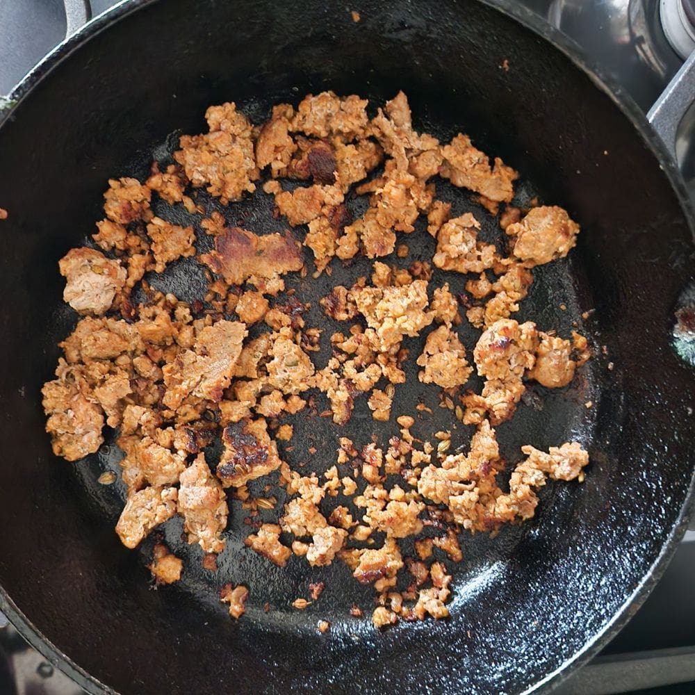 process step 1 sausage cooking in a skillet for pasta fagioli