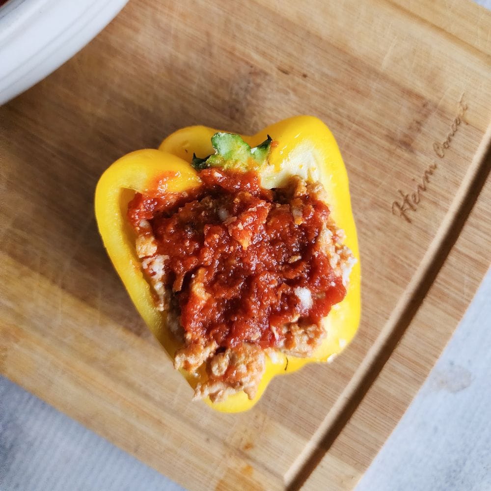 a picture of a stuffed pepper with sauce on top without cheese