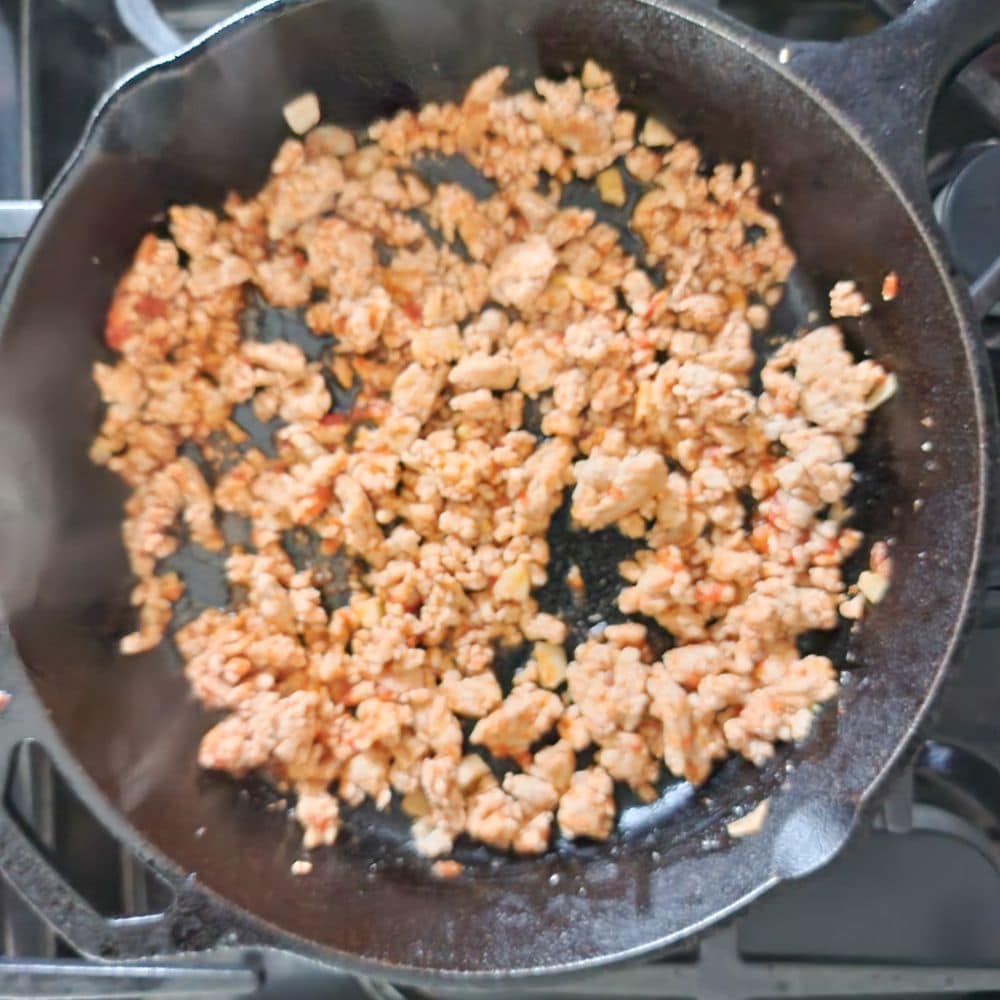 chicken cooking in a skillet