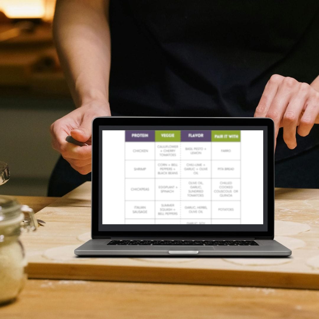 a picture of a computer screen with dinner builder on it and a person preparing food in the background