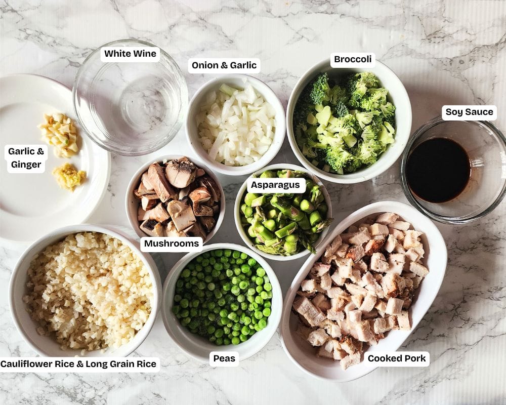 a picture of the ingredients of what you will need to make pork fried rice: cooked pork, vegetables, onion, garlic, soy sauce, mushrooms