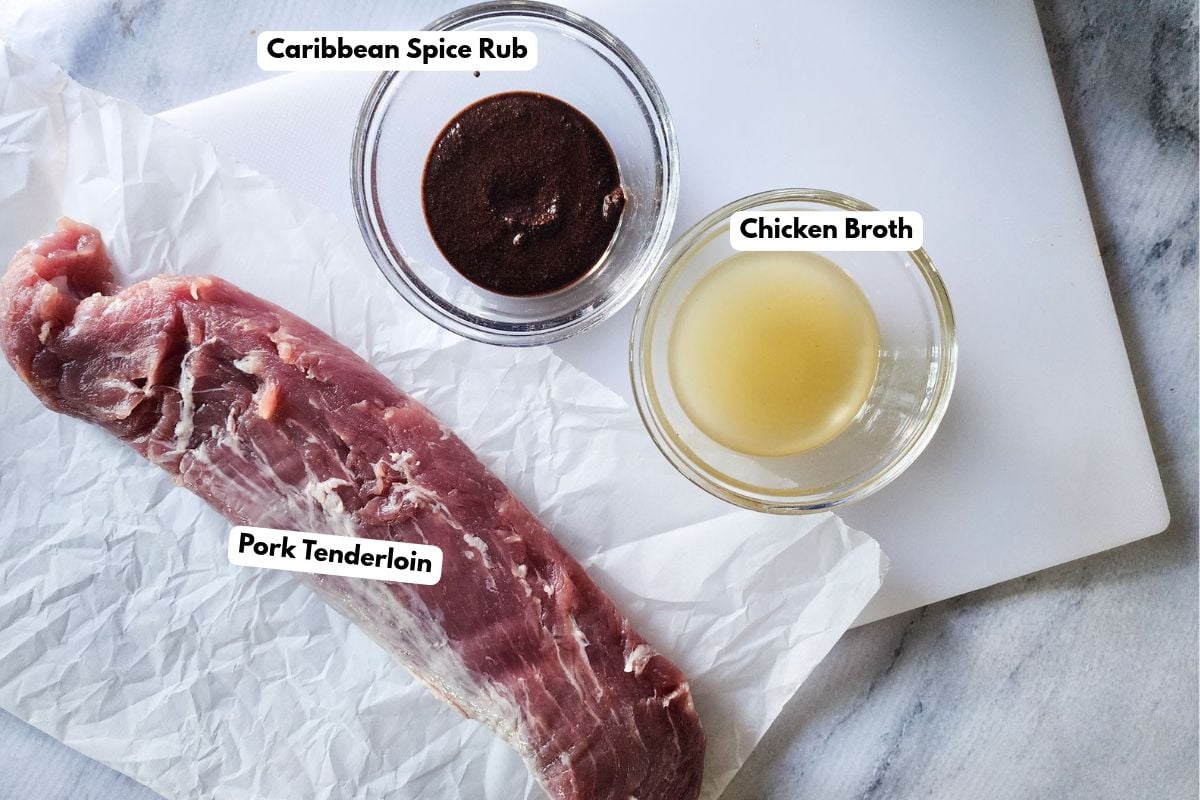 ingredients for Caribbean slow cooker pork tenderloin including pork tenderloin, chicken broth, soy sauce, and spices